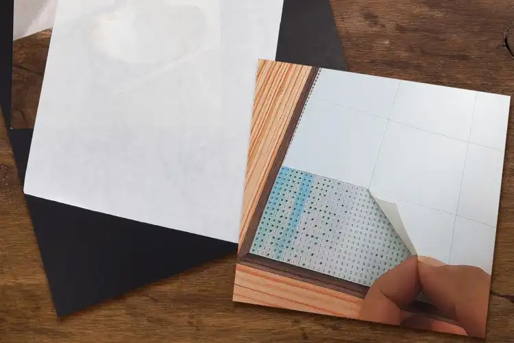 Why does glassine improve sterility and handling of wound dressings?